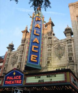 Exterior shot of the Louisville Palace with sign showing Tom Waits - Aug 7