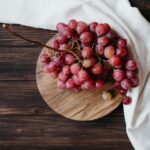 Grapes on table with white cloth