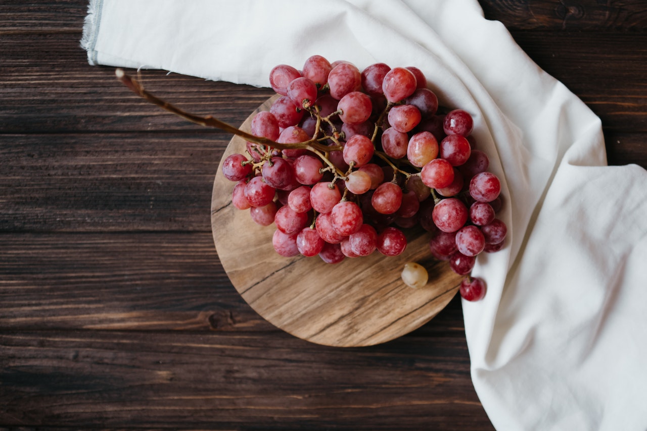 Grapes on table with white cloth